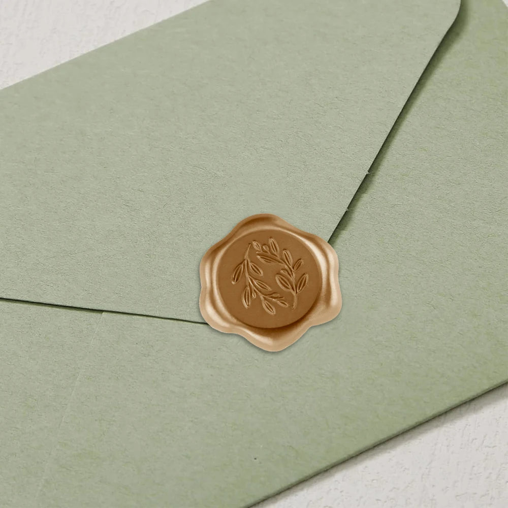 Gold seal sticker on a wedding invitation envelope